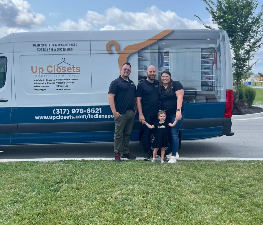 Up Closets franchise owner in front of their van in their neighborhood