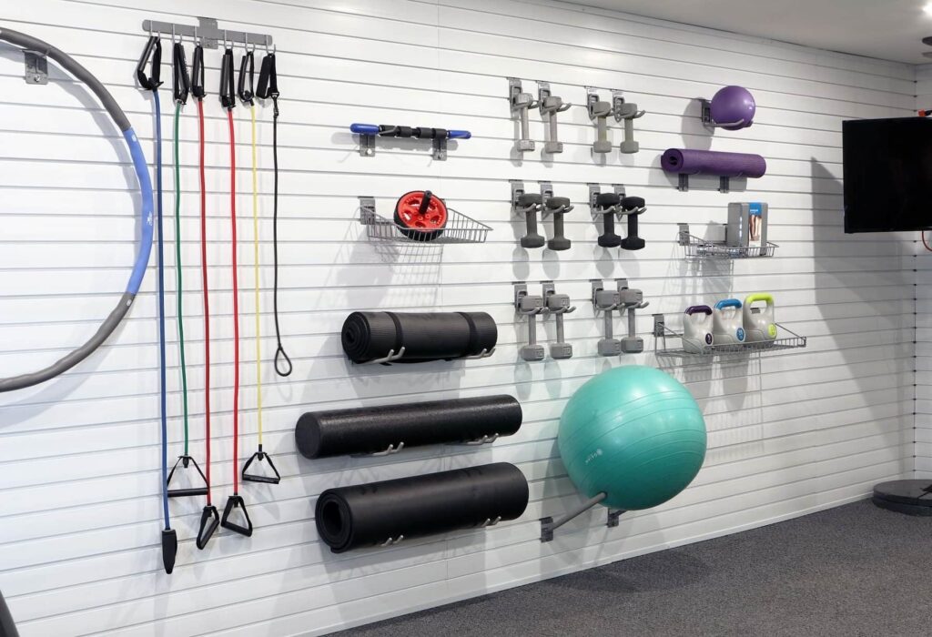 Organized workout space in a garage, custom built by Up Closets Custom closet franchise owner